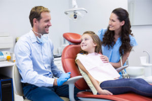 Mother and daughter with a dentist.