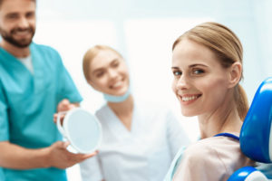 Lady at the dentist smiling.